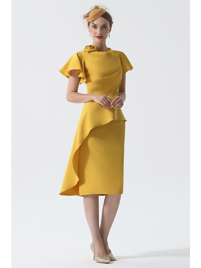 Model wearing the short sleeve knee-length formal dress.