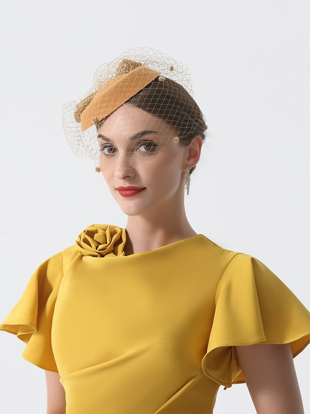 Cowl neck and short sleeve detail on the elegant dress.
