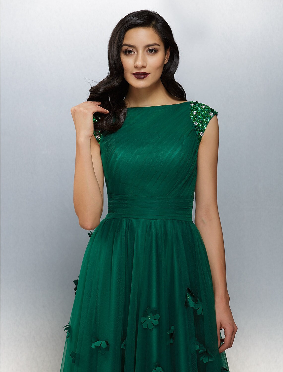 Model wearing the boat neck A-Line dress, full length view.