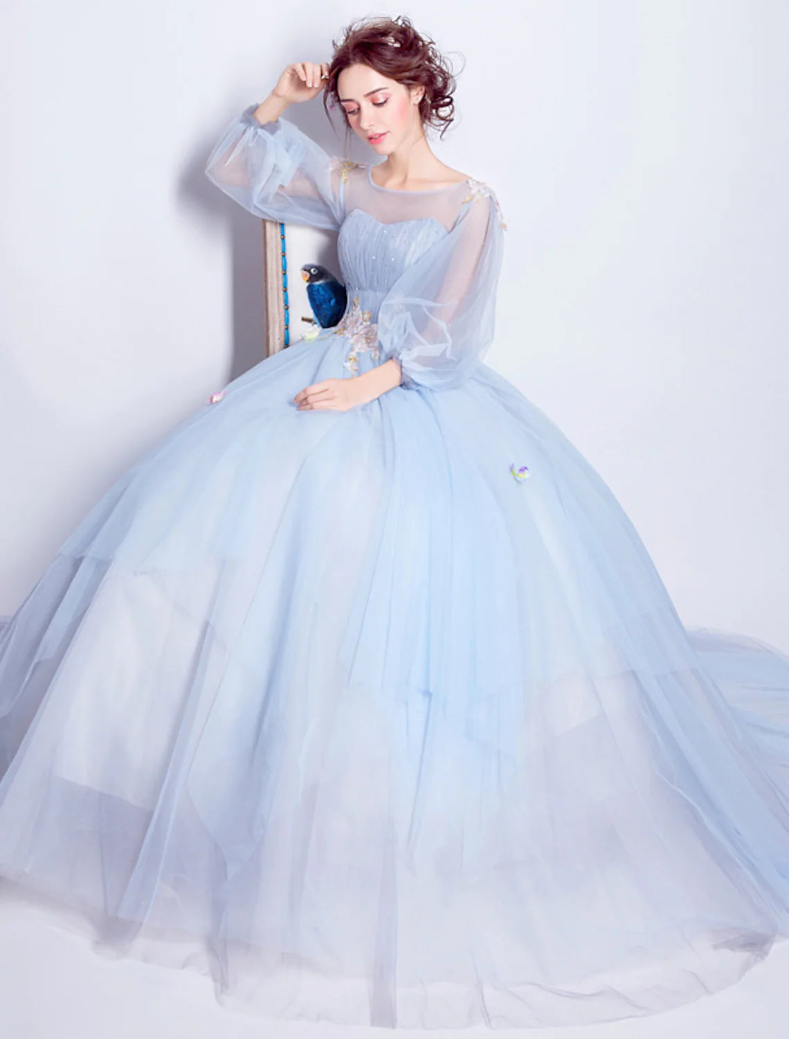 Side view of elegant quinceanera dress with puffy skirt and floral details.