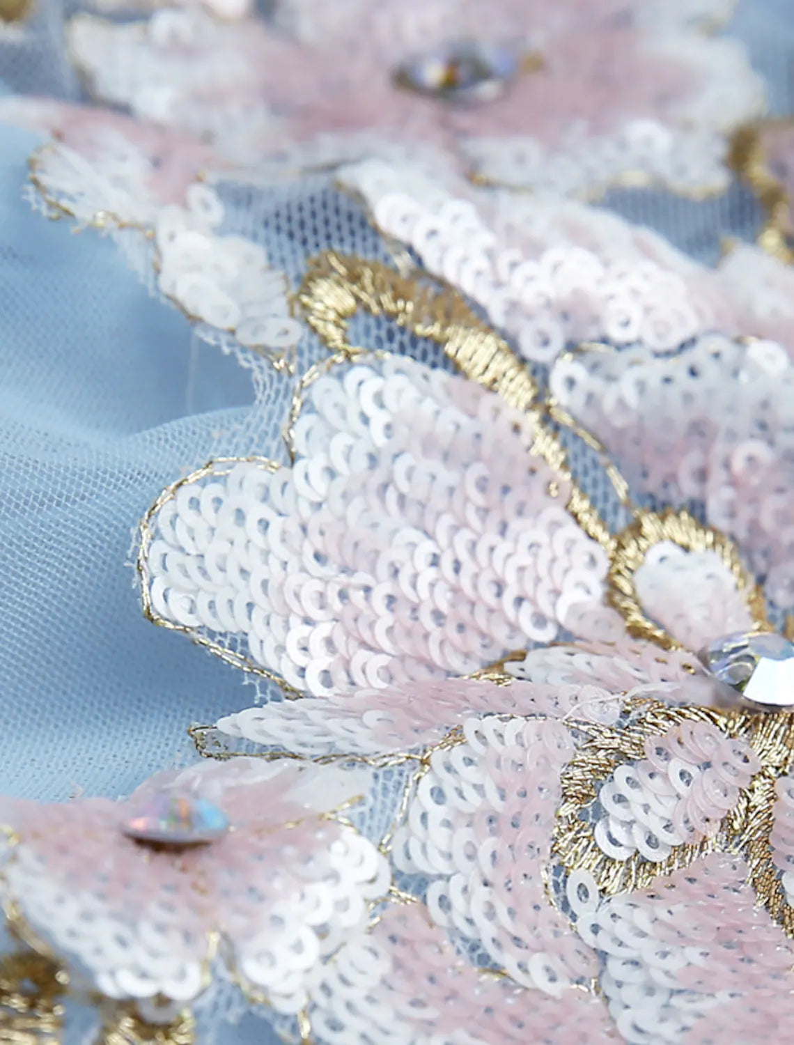Model showcasing the elegant silhouette of the puffy floral ball gown.