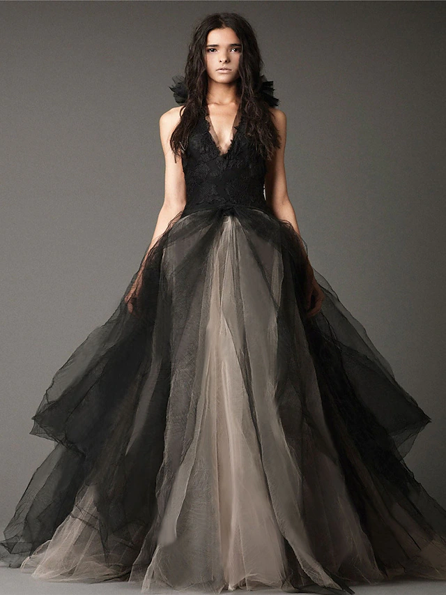 Front view of an elegant black halter neck ball gown wedding dress with appliques.