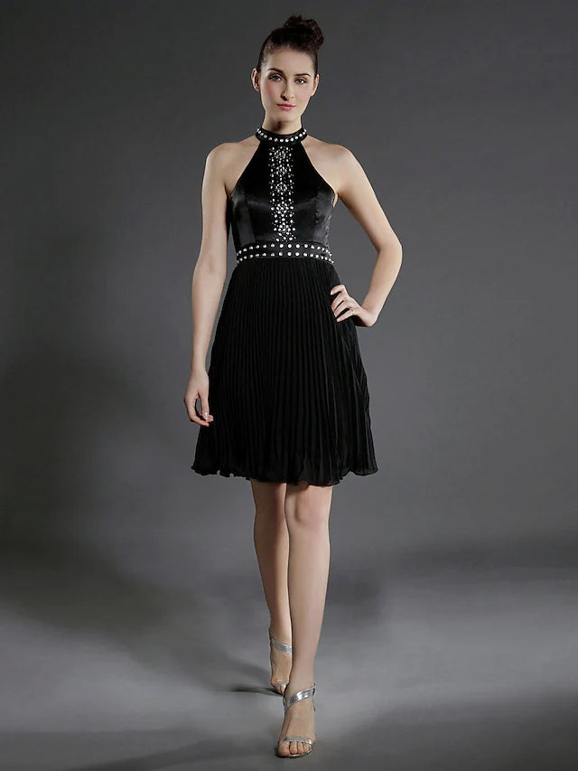 Elegant black chiffon ball gown with high neck and pleats.