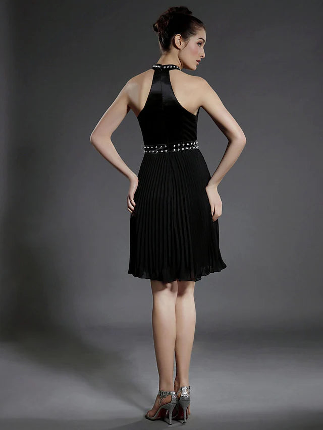Back view of black high neck dress with beaded details.