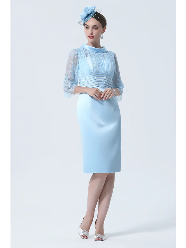 Close-up of the illusion jewel neckline and half sleeve detail on the dress.