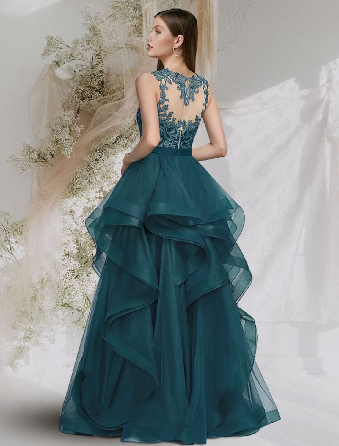 Full view of a floor-length tulle ball gown featuring a jewel neck and delicate lace accents.