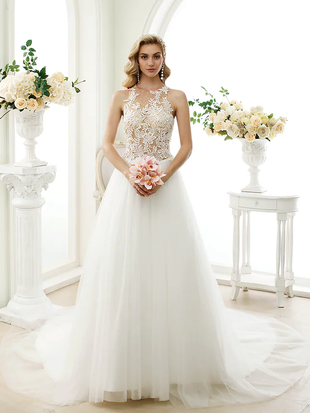 Elegant white ball gown wedding dress with jewel neck and lace appliques.