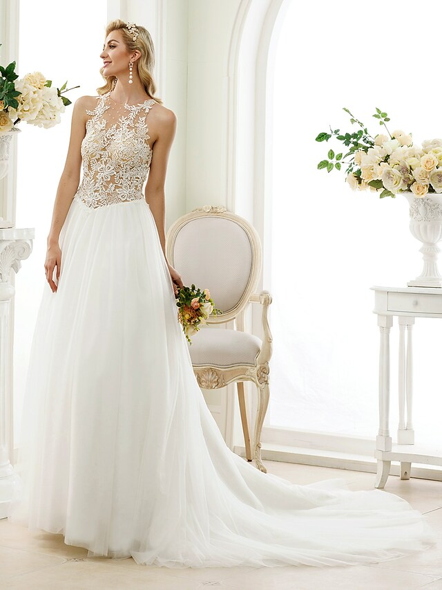 Detailed view of the button-up see-through back of the wedding gown.