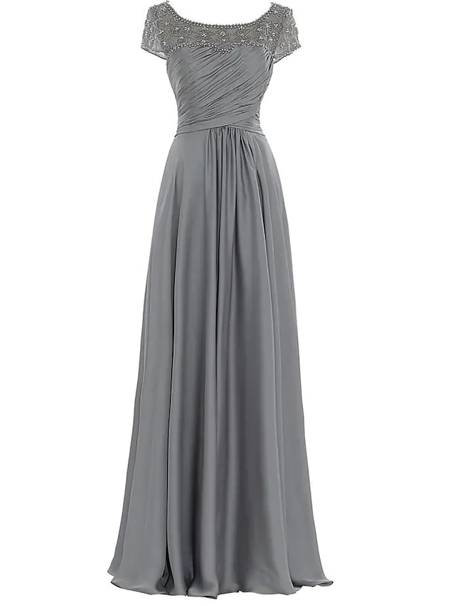A woman wearing an elegant floor-length jewel neck mother of the bride dress with pleats and beading.