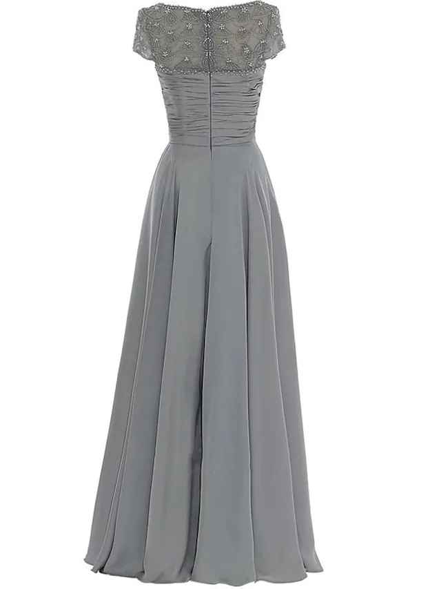 Close-up of the jewel neck and beaded details on the elegant mother of the bride dress.
