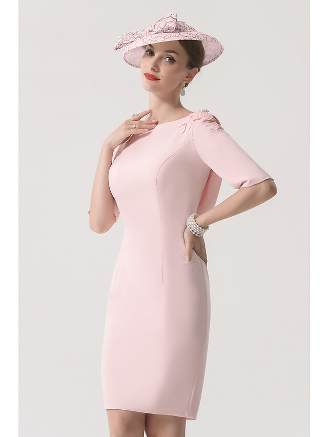 Elegant Mother of the Bride dress with jewel neck and half sleeves.