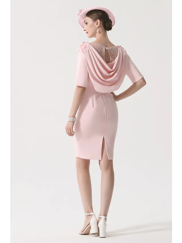 Knee-length Mother of the Bride dress in stretch satin with appliques.