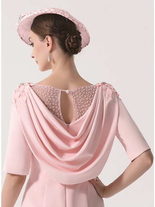 Model wearing elegant knee-length Mother of the Bride dress.