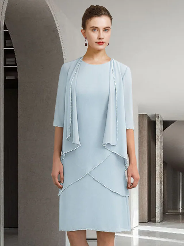 Elegant Mother of the Bride dress with jewel neck, half sleeves, chiffon, and lace details.