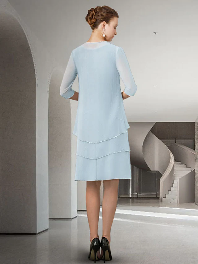Mother of the Bride dress, side view, highlighting the knee-length silhouette.
