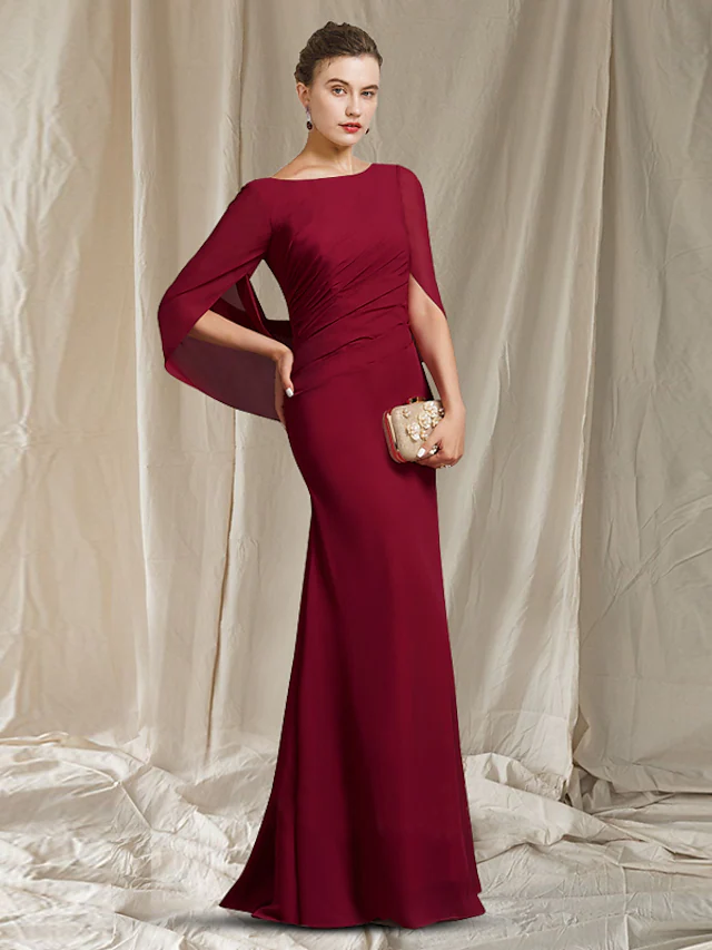 Elegant Mother of the Bride dress with jewel neck and half sleeves.
