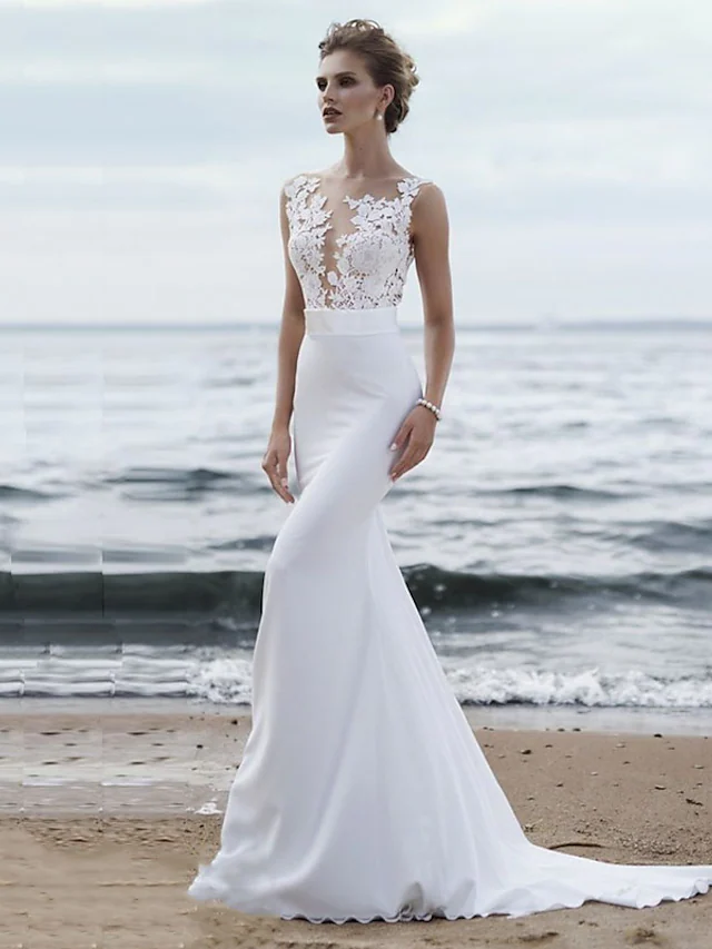 Elegant mermaid wedding dress with jewel neck, lace appliques, and chapel train.
