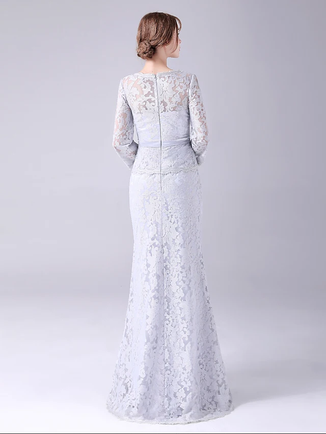Back view of a floor-length Mother of the Bride gown with sash and ribbon detail.