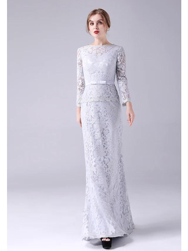 Close-up of the lace detail and sash on the Mother of the Bride dress.