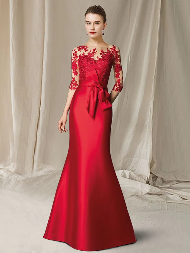 Elegant dark blue mermaid gown with jewel neck and half sleeves.
