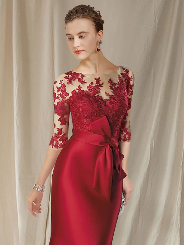 Close-up of the lace bodice, jewel neck, and half sleeve details.