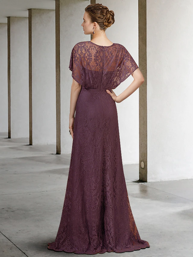 Side view of elegant lace Mother of the Bride dress with pleats.