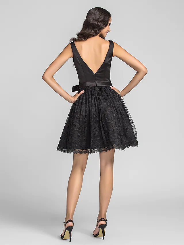 Close-up of the black sleeveless bridesmaid dress, highlighting the lace and charmeuse fabric.
