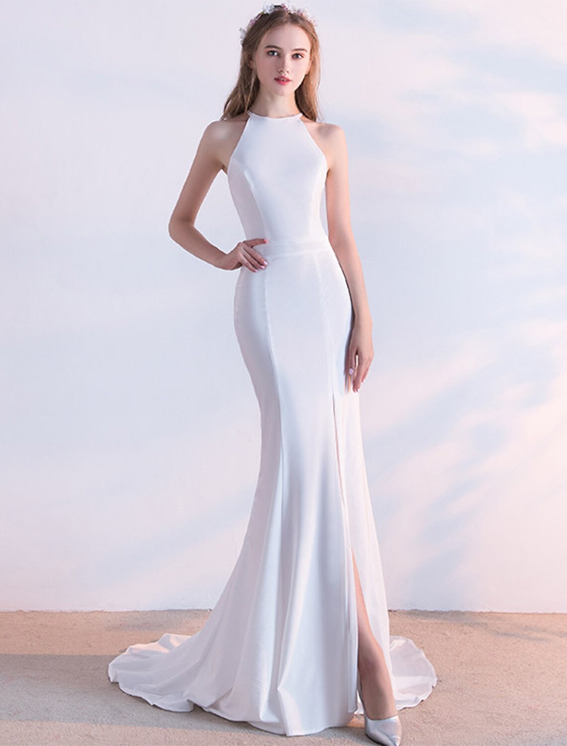 Elegant mermaid halter evening gown with a sweep train.