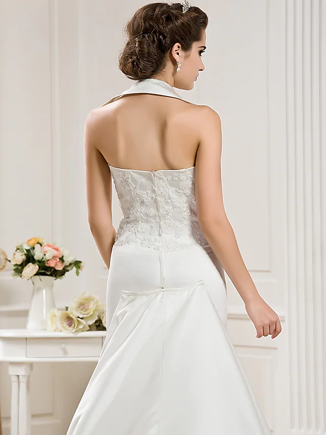 Bride walking, showcasing the flow of the court train on the wedding dress.