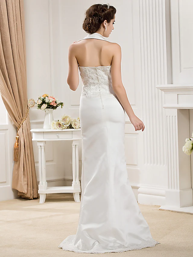 Bride from a distance, showing the overall elegance of the white wedding gown.