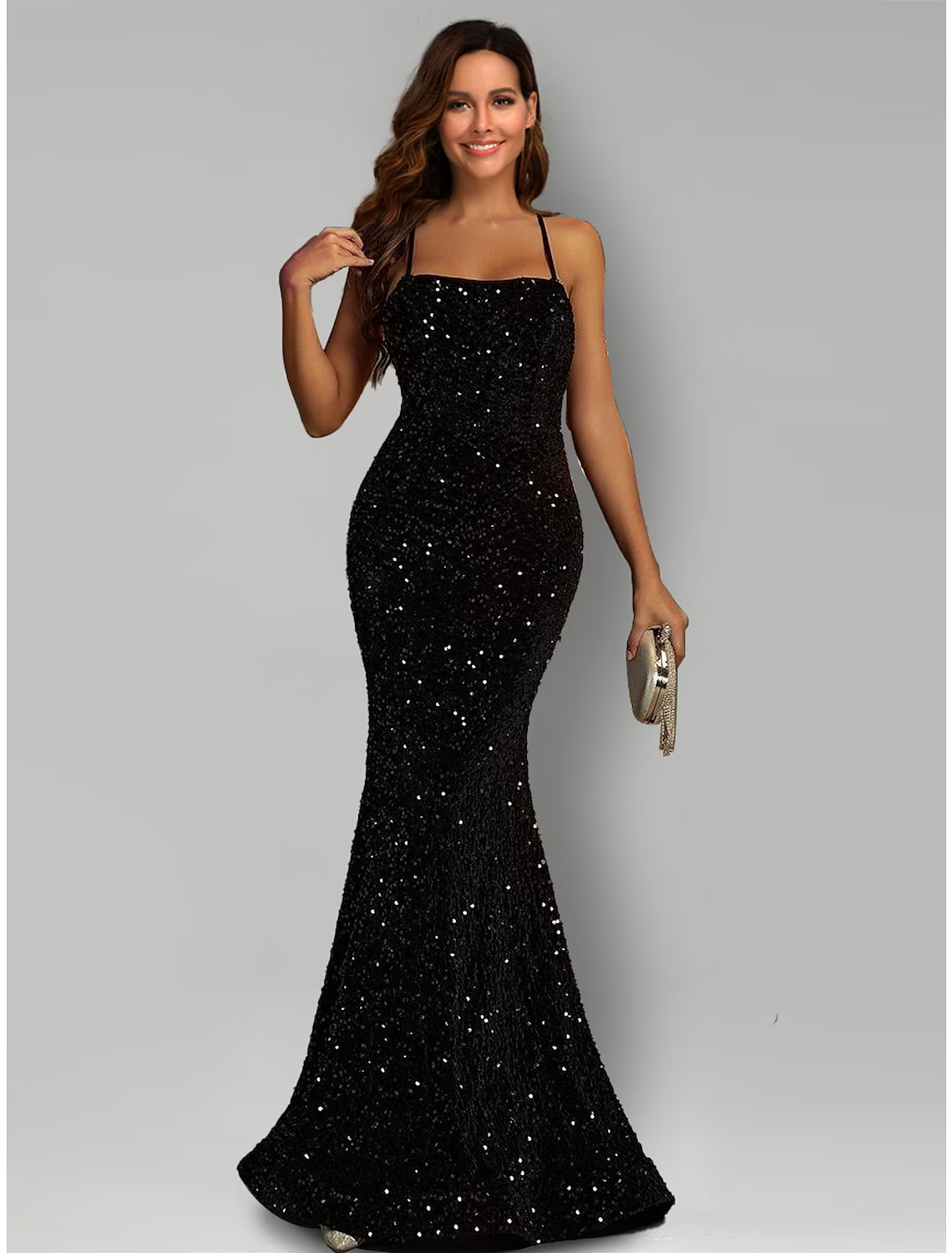 Black sequined mermaid evening gown with halter neckline and sweep train.