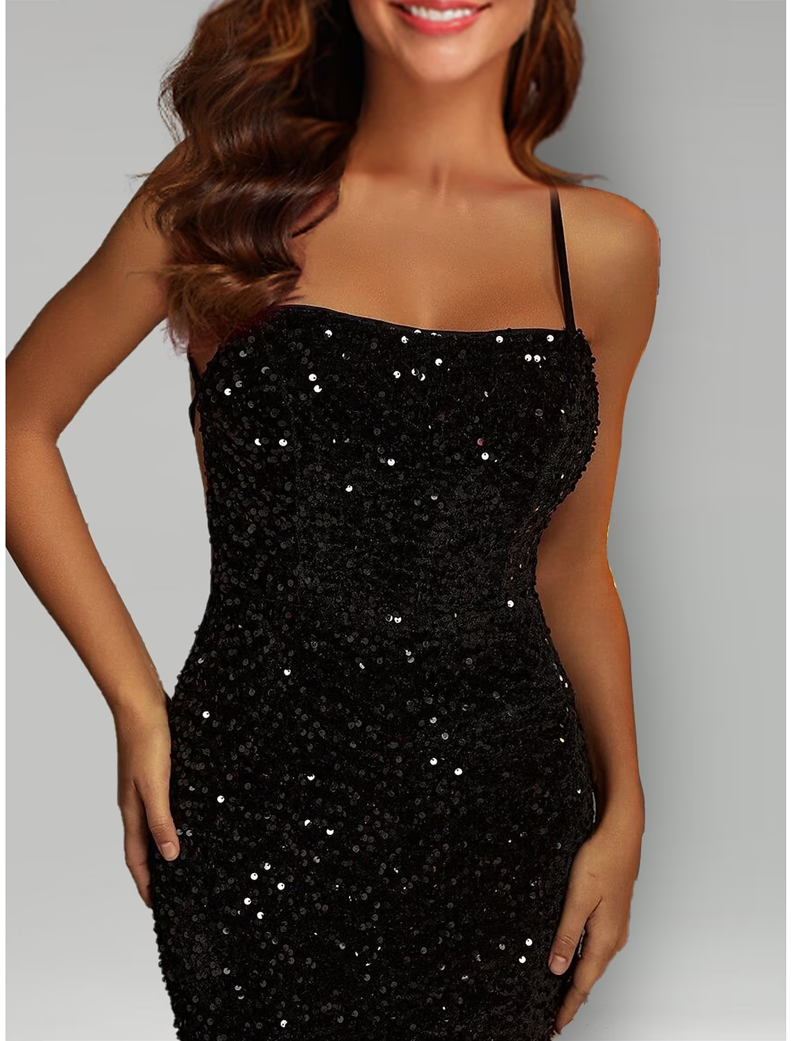 Elegant black sequined formal dress in mermaid silhouette.