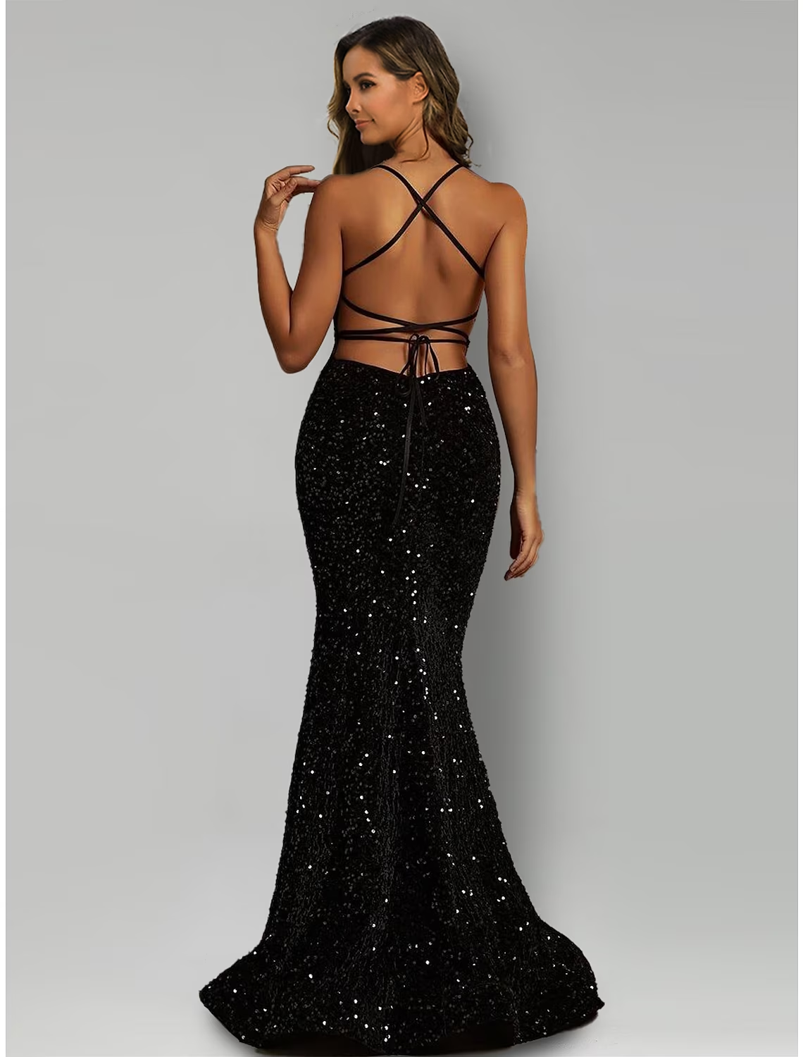 Close-up of sequin details on a black halter evening gown.