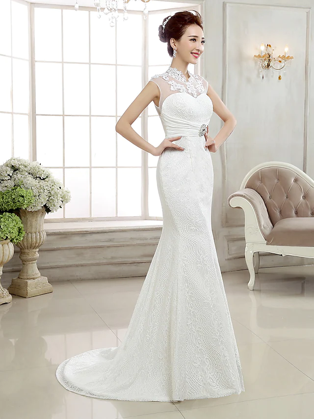 Side view of an elegant mermaid wedding dress with a sweep train.