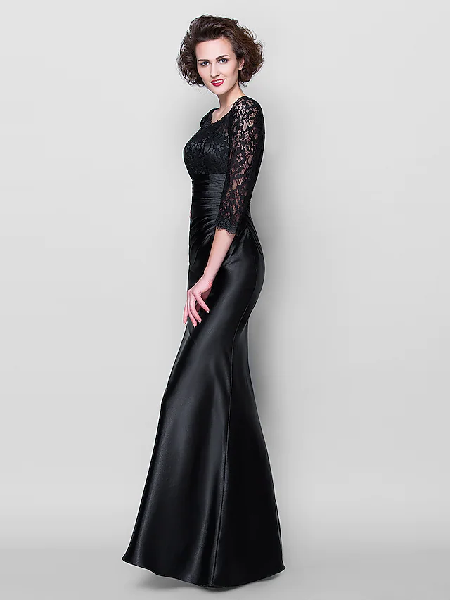 Detail of the 3/4 length lace sleeves on the formal dress.