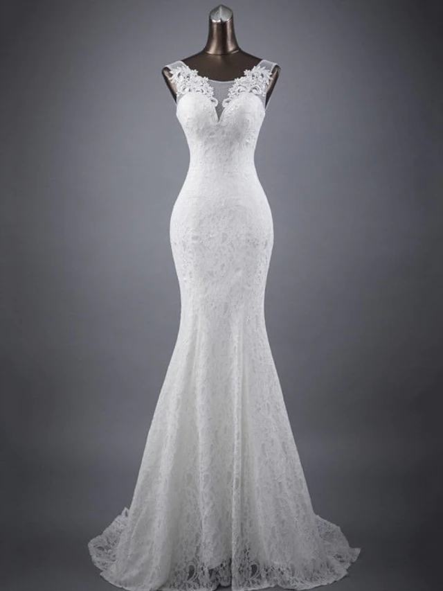 Elegant mermaid wedding dress with jewel neck and lace appliques.