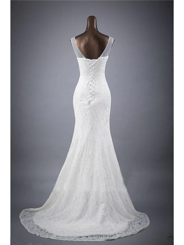 Back view of mermaid wedding dress featuring a court train and lace details.