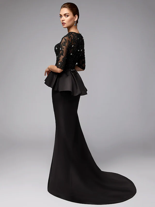 Side view of elegant navy blue lace and satin Mother of the Bride gown.