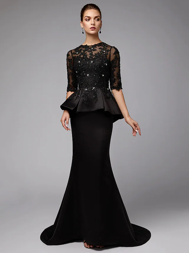 Profile view of the mermaid silhouette navy formal dress.