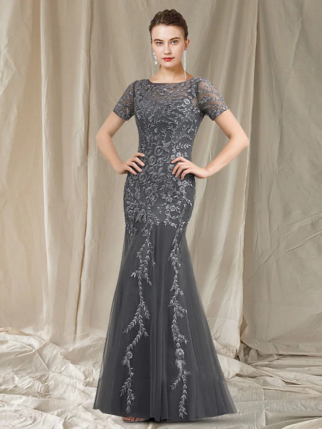 Elegant mermaid mother of the bride dress with jewel neck, lace appliques, and short sleeves.