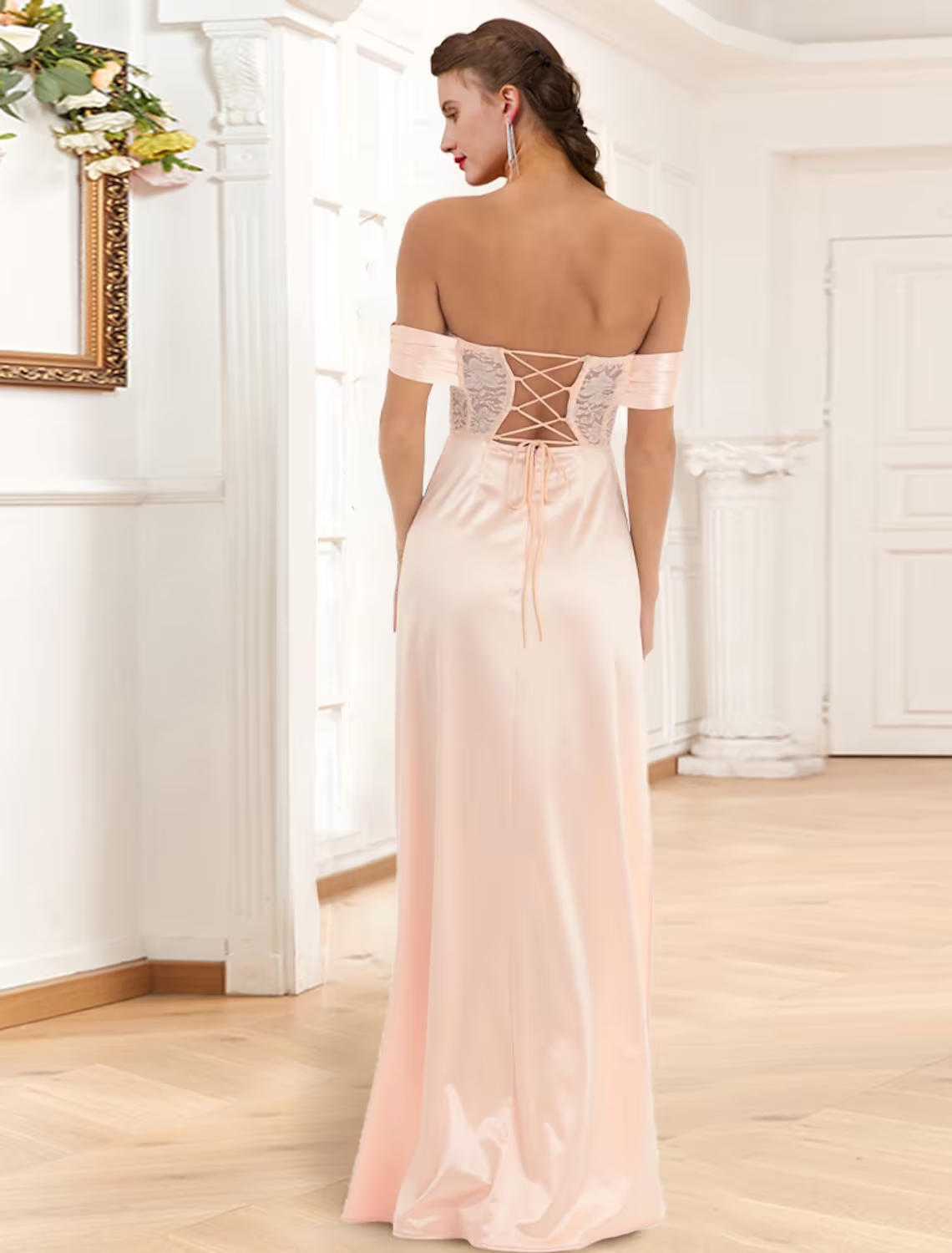 Close-up of the lace and applique details on an off-shoulder mermaid prom dress.
