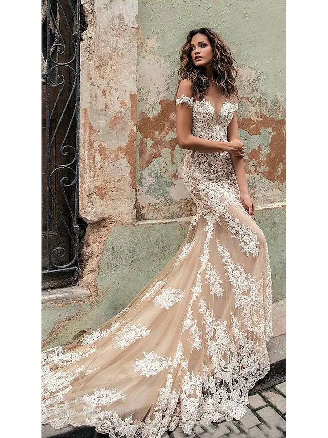 Elegant mermaid off-shoulder lace wedding dress with a court train.