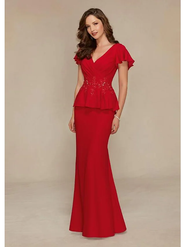 Elegant Mother of the Bride dress with plunging neckline, short sleeves, beading, and ruching.