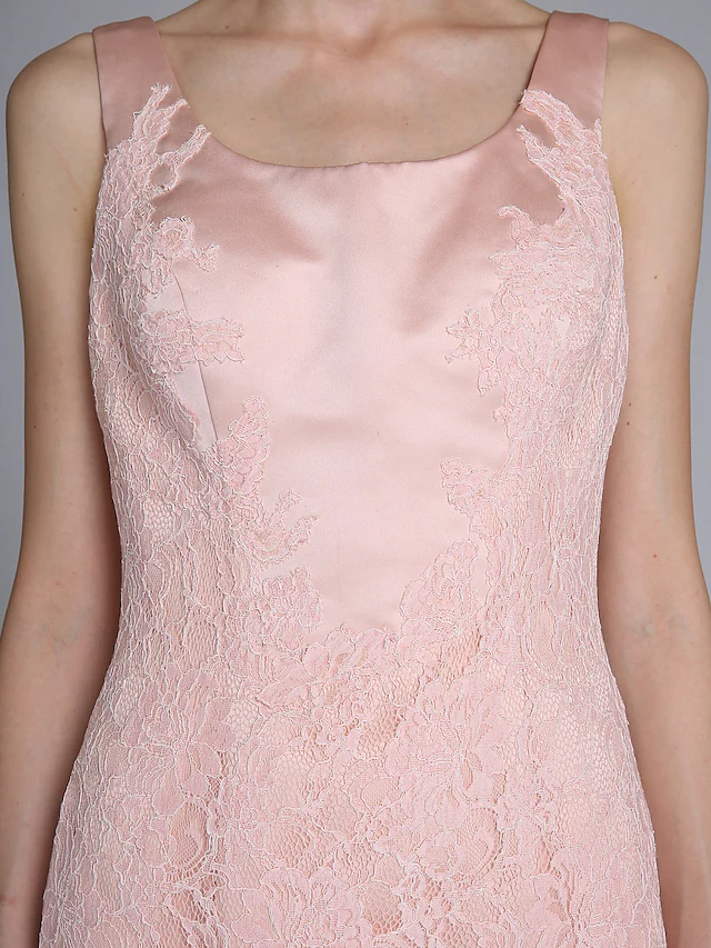 Close-up of the luxurious satin fabric and lace embellishments.