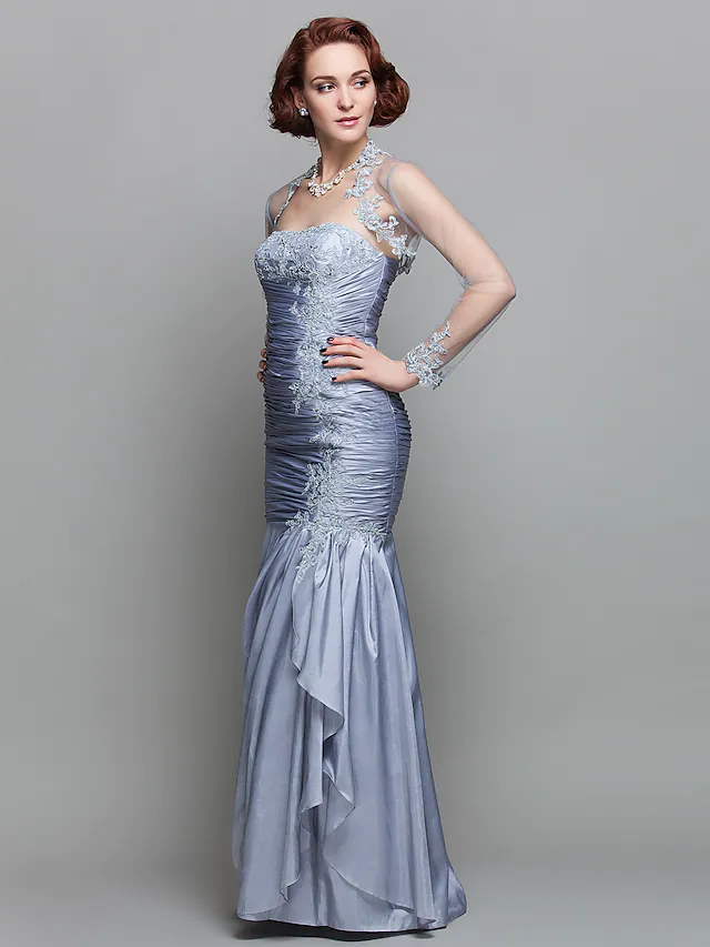 Side view of the strapless mermaid gown, highlighting the ruched taffeta and beading.
