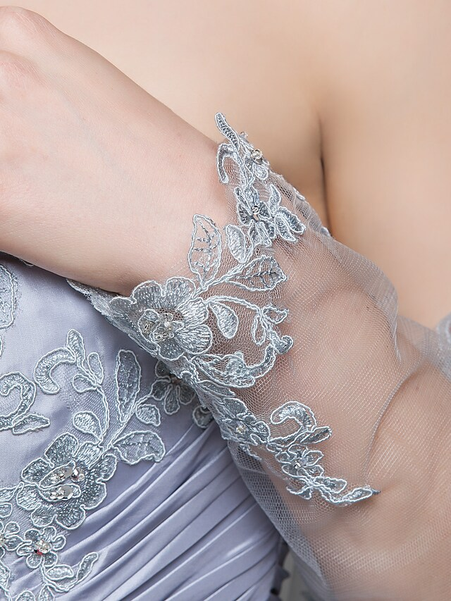 Detail of the long-sleeve wrap included with the Mother of the Bride dress.