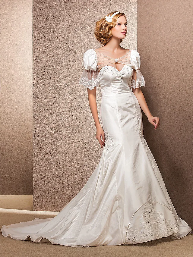 Elegant sweetheart neckline wedding dress with a court train.