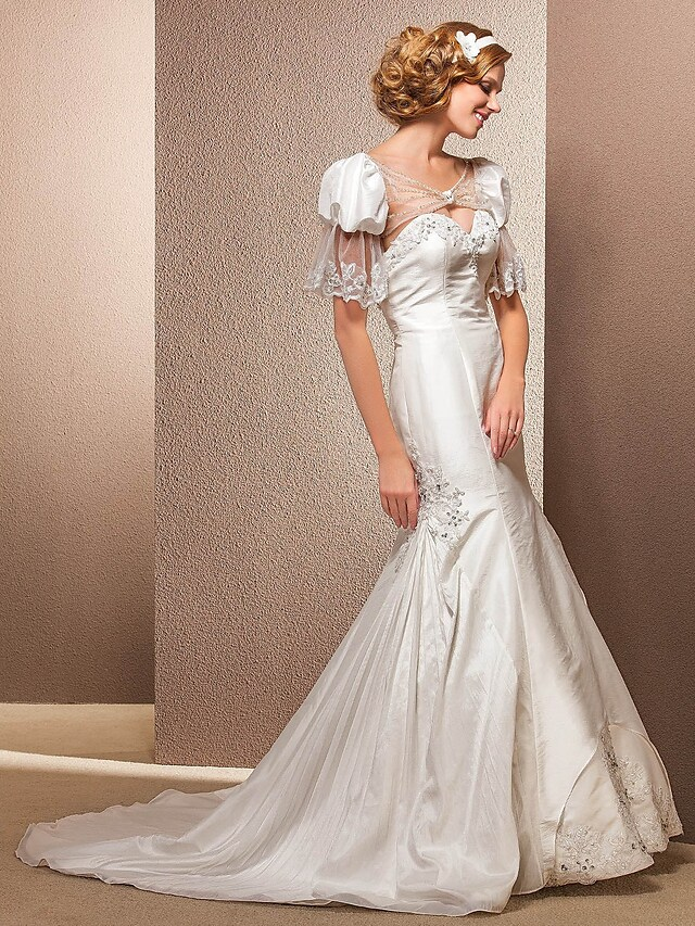 Back view of a taffeta wedding dress with a court train.