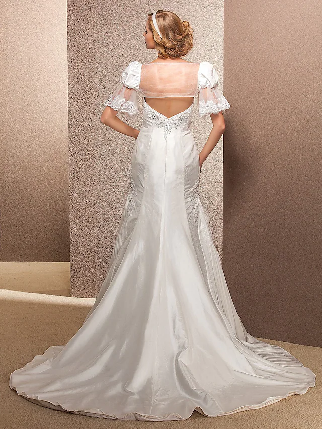 Close-up of the sweetheart neckline on a wedding dress.