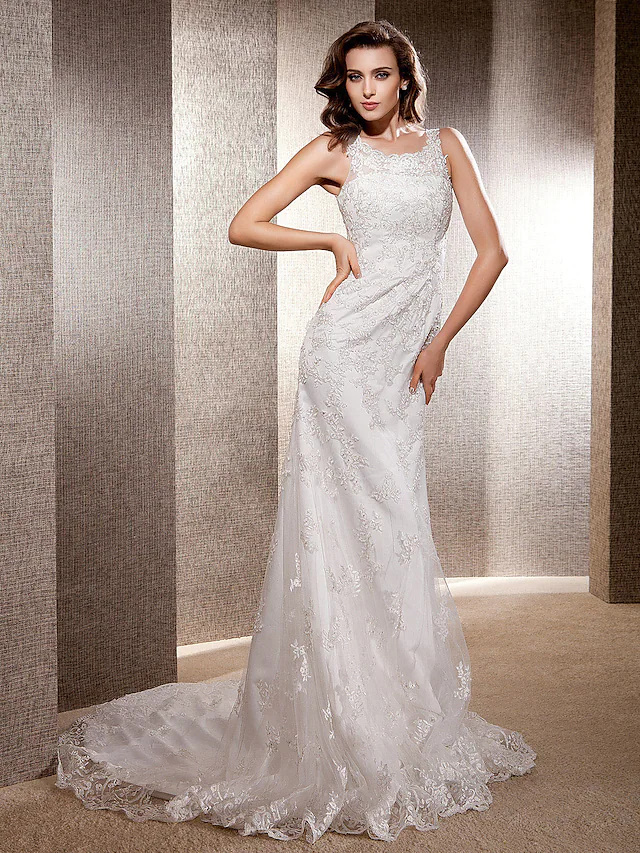 Elegant mermaid trumpet wedding gown with scoop neck and lace bodice.